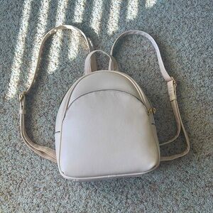 beige color mini backpack with gold zipper!